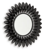 Round accent mirror with dark metal petal frame, angled view