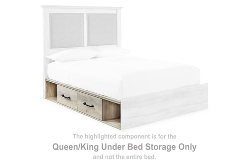 Whitewash under-bed storage unit with drawers and open shelf at bed level