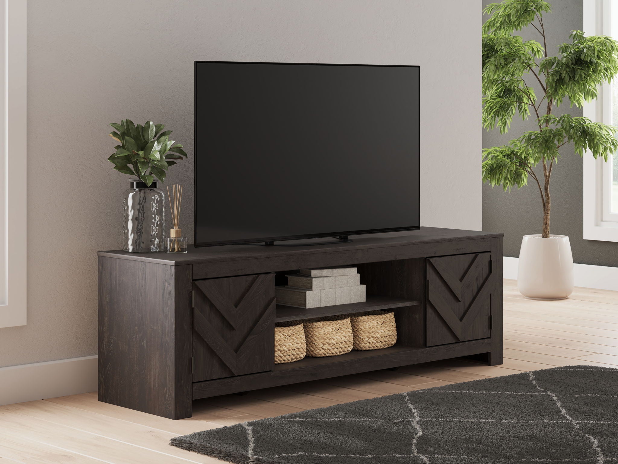 Dark wood fireplace TV stand with open shelving and angled chevron paneling