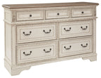 Two-tone dresser with six drawers and dark metal cup handles, angled front view.