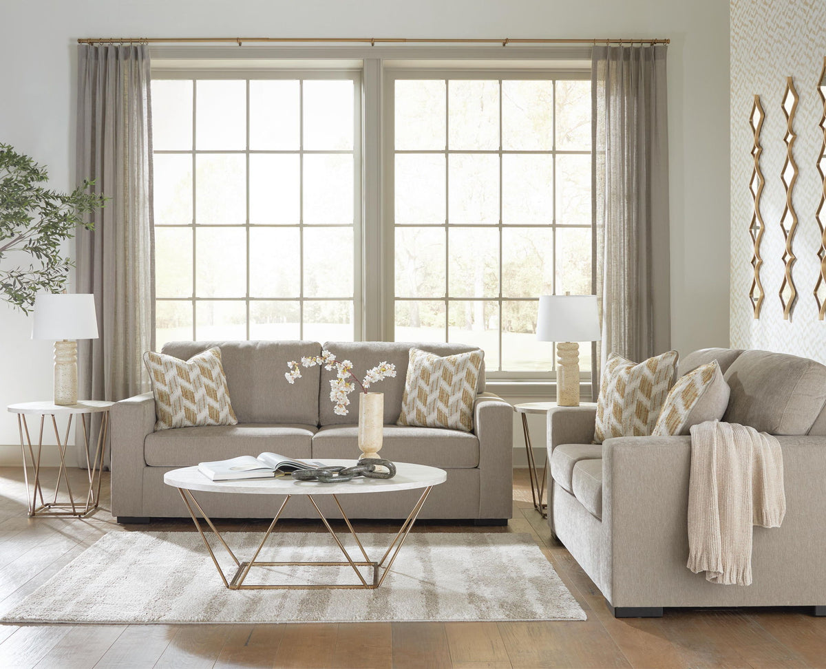 Living room set: light gray sofa and loveseat with beige patterned accent pillows