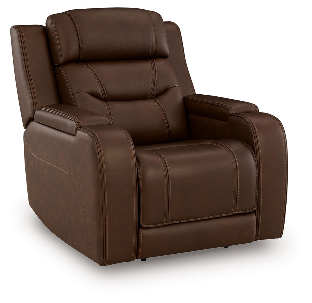 Power recliner chair in dark brown faux leather with extended footrest and armrest console