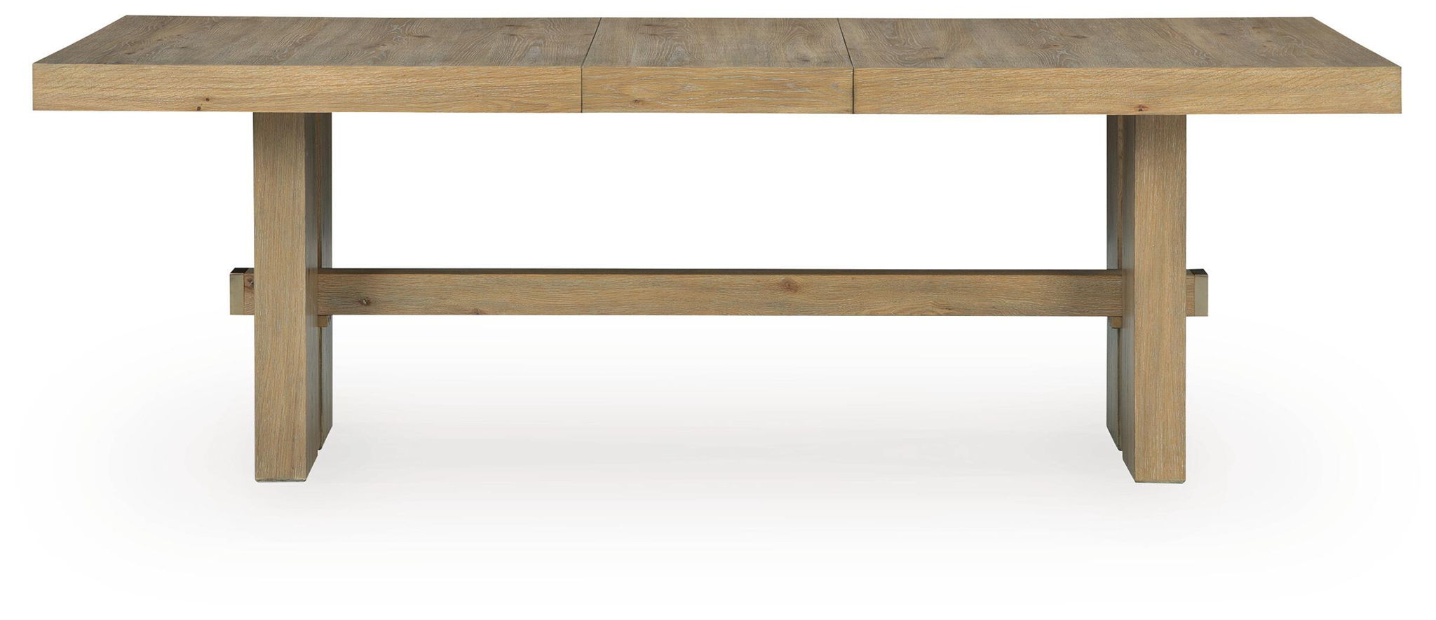 Light brown rectangular dining table with visible extension panels and apron-style sides