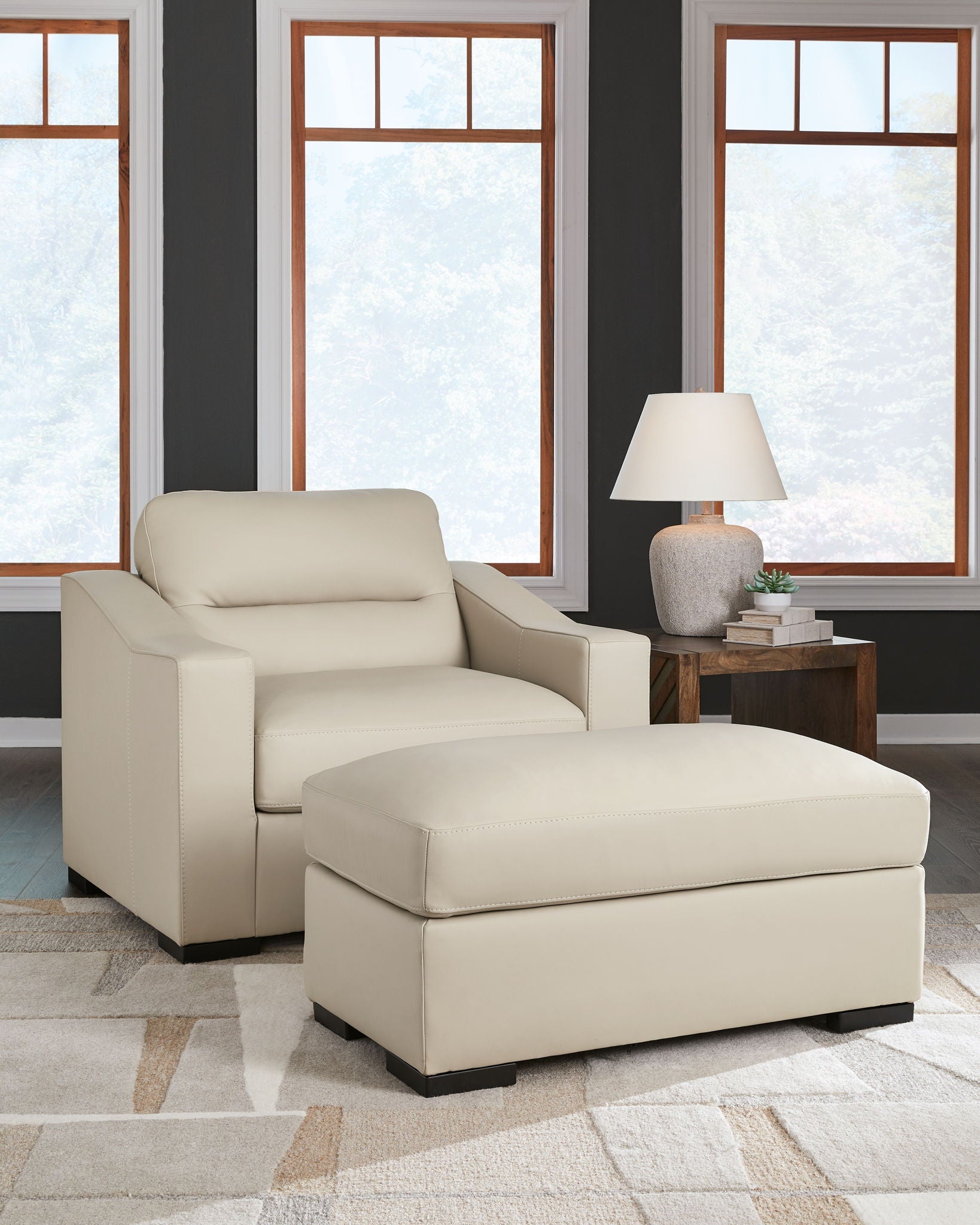 Almond chair and a half with matching ottoman, cushions, and block feet.