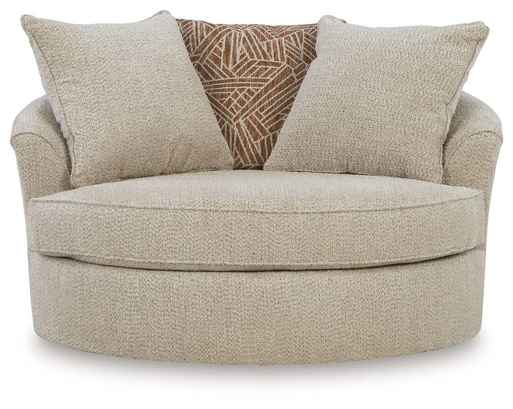 Oversized swivel accent chair with two back cushions and center patterned throw pillow