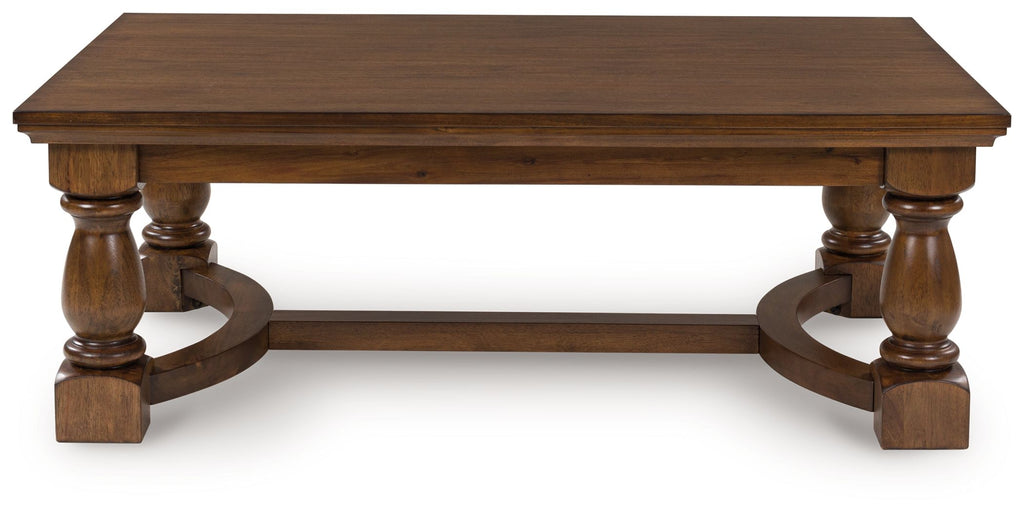 Rectangular brown cocktail table with two end pedestals and curved side frame