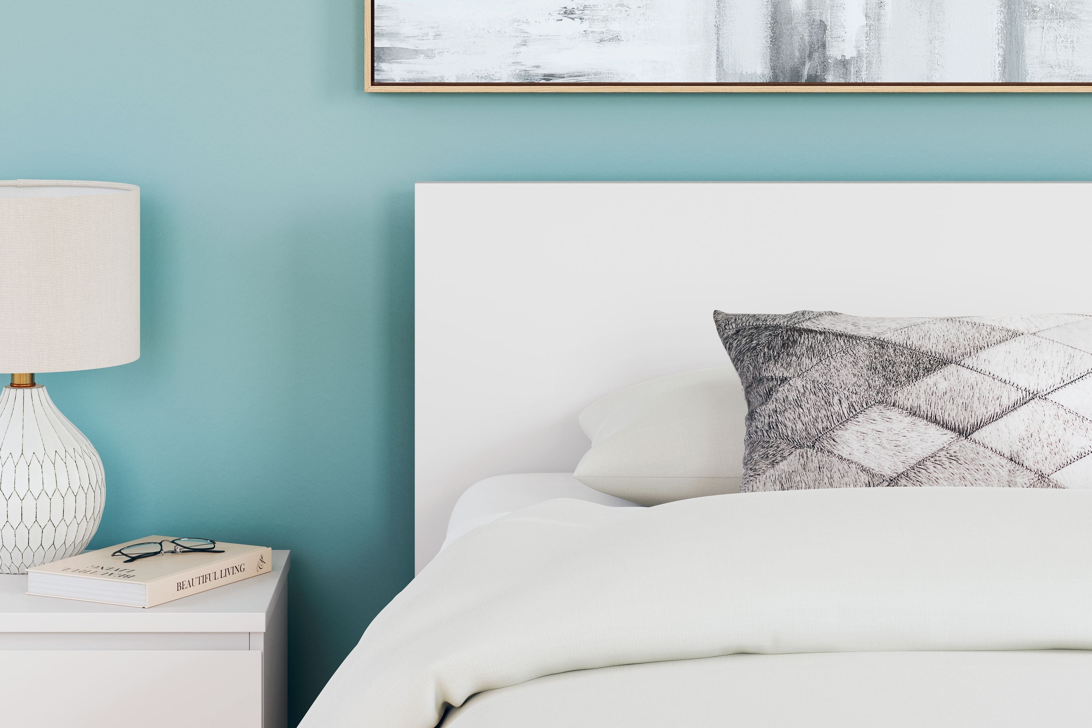 Light color panel headboard with padded top and gray geometric accent pillow
