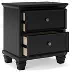 Black two-drawer nightstand with open drawers and round metal knobs