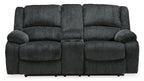 Dark gray reclining loveseat with two seat sections and padded back cushions