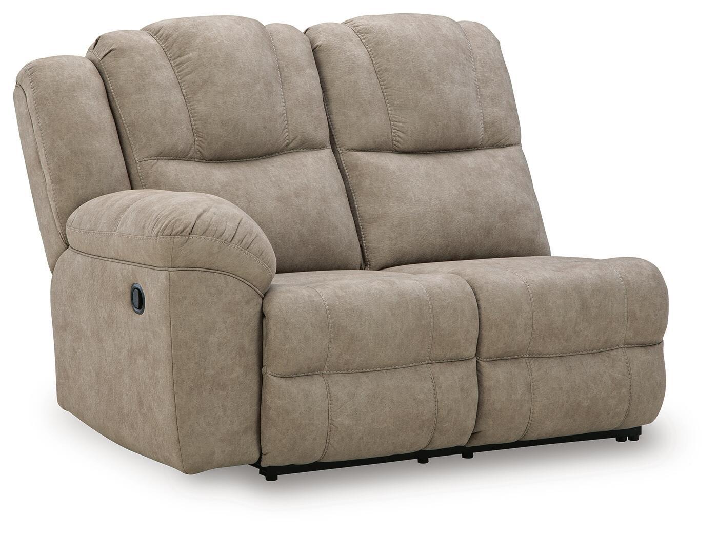 Light beige reclining loveseat with padded arms and tufted back cushions