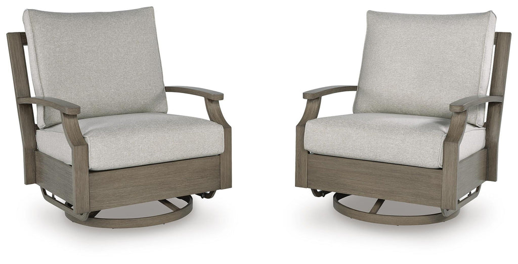 Pair of swivel glider chairs with light beige cushions and dark brown frames