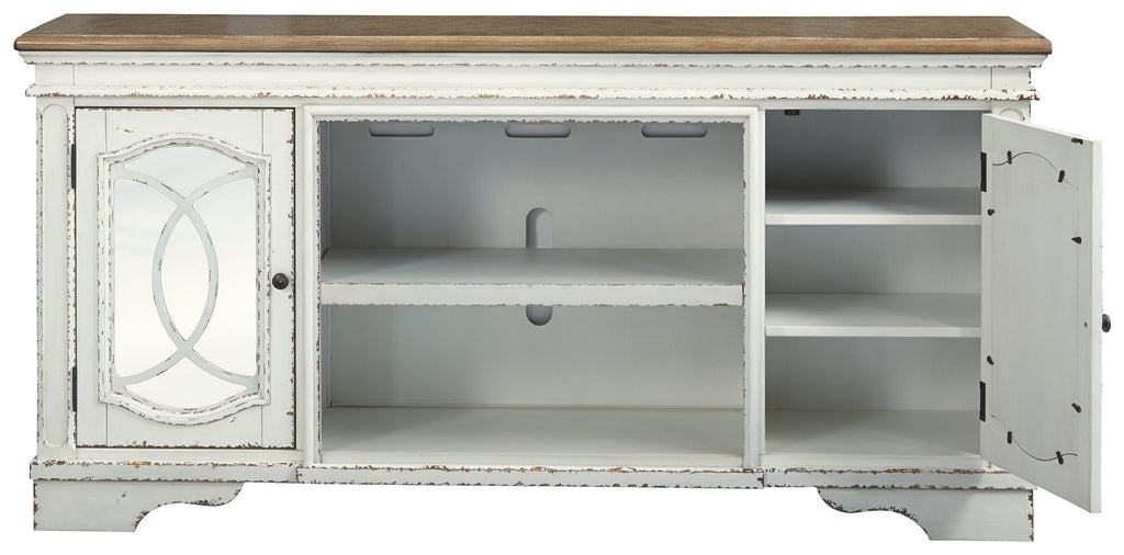 Chipped white TV stand with open center shelf and side storage behind doors