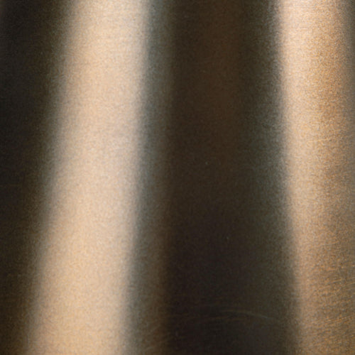 Bronze accent table pedestal finish texture close-up with smooth metal sheen