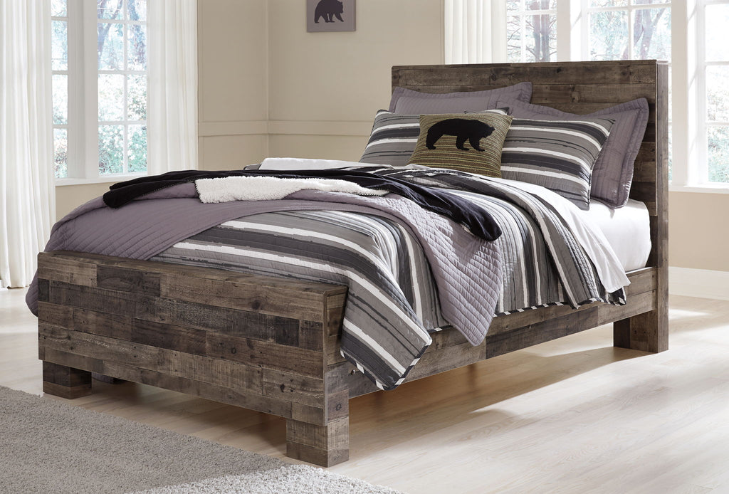 Rustic panel bed with dark wood frame and striped bedding with gray and black layers