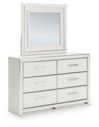 White dresser with square mirror and three rows of drawers with silver bar pulls