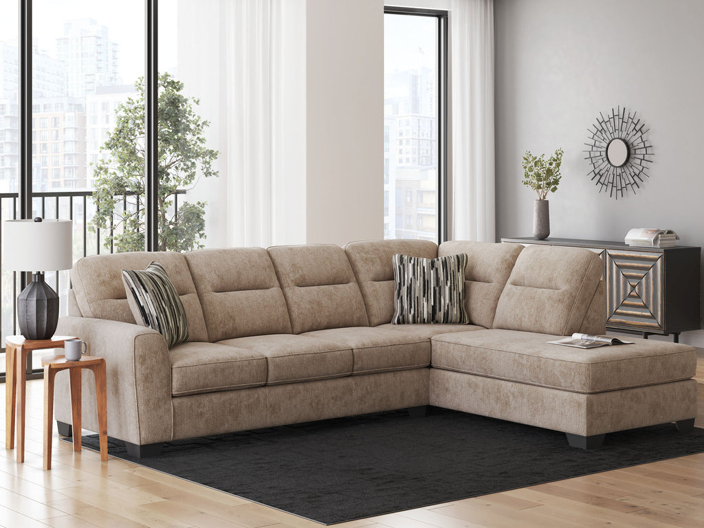 Mocha sectional sofa with corner chaise, patterned throw pillows and tufted seating cushions