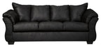 Black sofa with channel-stitched back, three seat cushions, and rolled arms