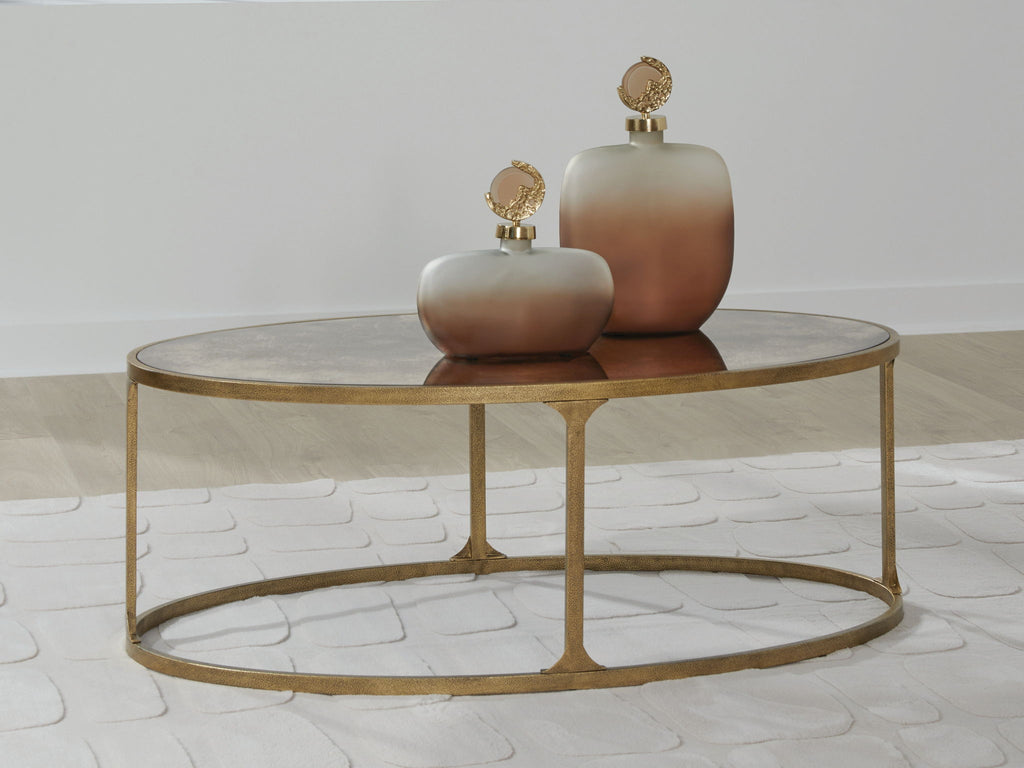 Round side table with light gray stone top and gold metal base, central pedestal