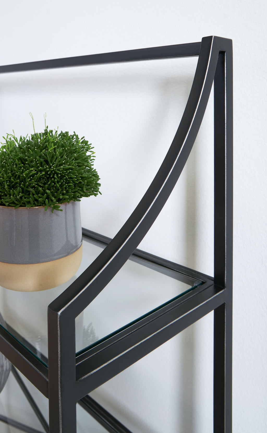 Antique black bookcase frame with curved corner supports