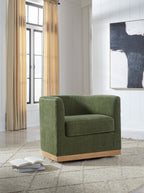 Forest green swivel accent chair in room, upholstered arms and seat with light wood base