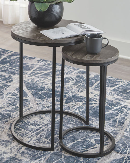 Round accent table set: larger and smaller gray tops on black metal ring bases