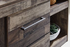 Entertainment center drawer with dark gray wood panel and brushed metal pull