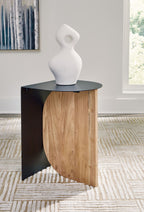 Black accent table with round top, natural wood base, styled with white vase