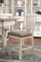 Beige dining chair with upholstered seat near a white buffet sideboard
