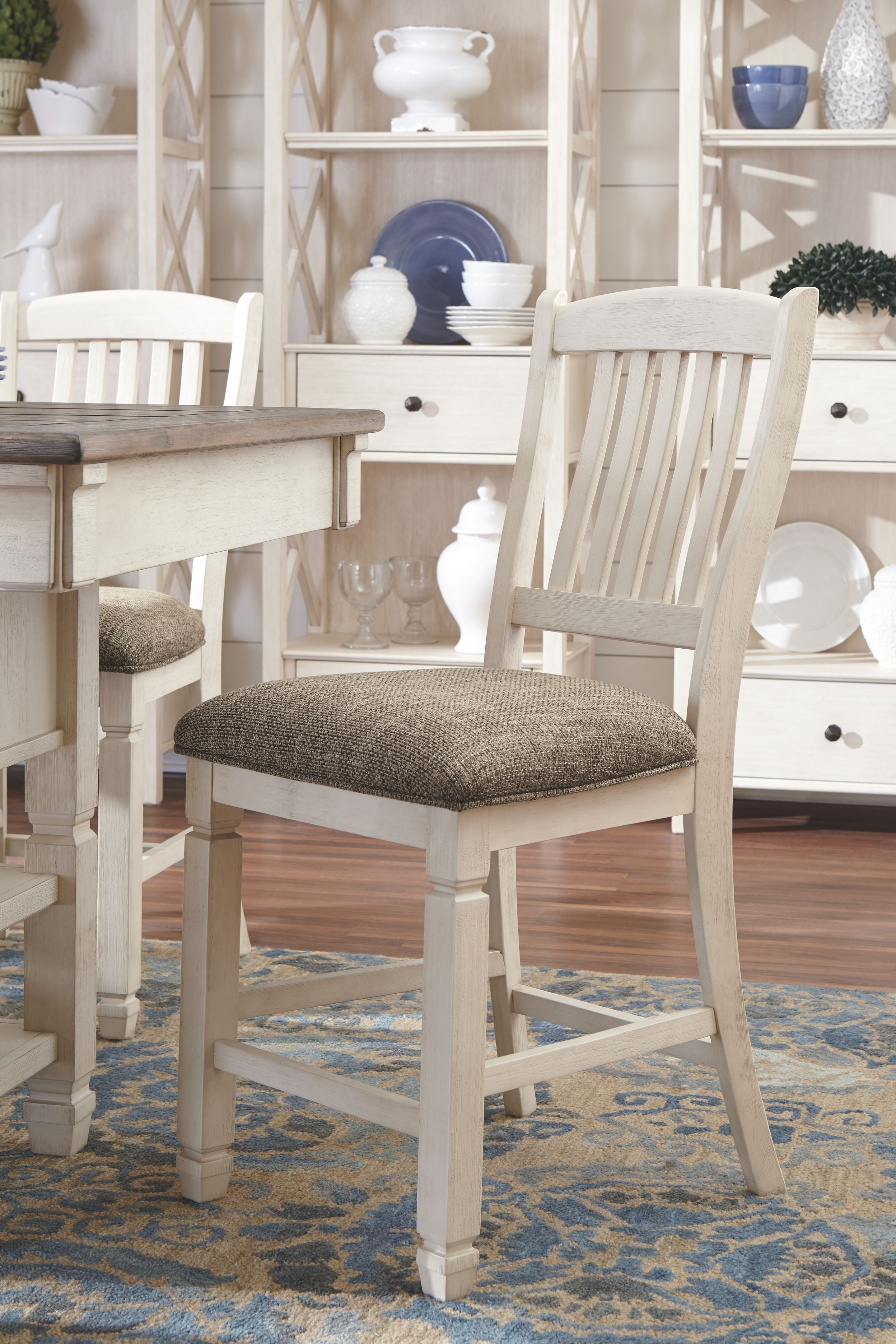 Beige dining chair with upholstered seat near a white buffet sideboard