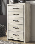 Light wood dresser with four drawers and black bar handles, angled front view