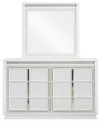 White dresser with attached mirror and paneled cabinet doors with mesh trim