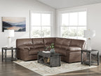 Brown sectional sofa with tufted back cushions and rolled armrests