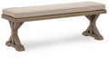 Outdoor bench with beige cushion and angled wooden legs