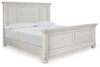 White panel bed frame with two pillows and light bedding, slatted headboard and footboard