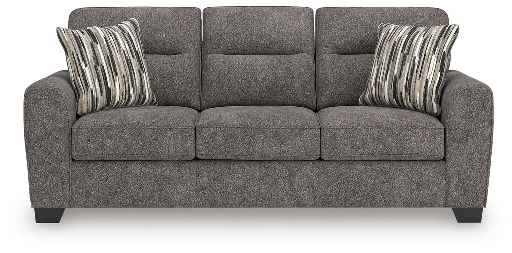 Dark gray sofa with three seat cushions and two striped lumbar pillows