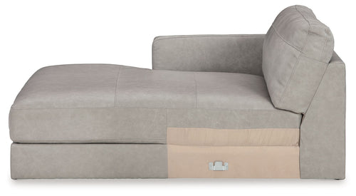 Light gray corner chaise sofa with beige side panel and rounded back