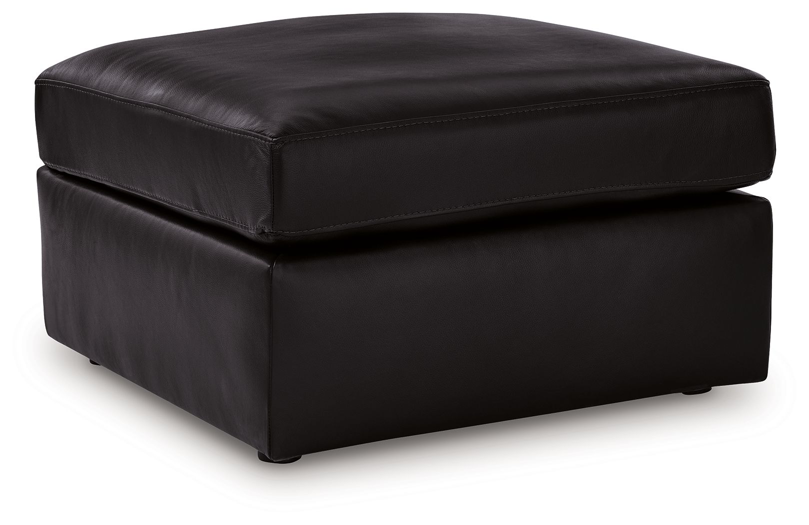 Black oversized accent ottoman with rounded edges and padded top