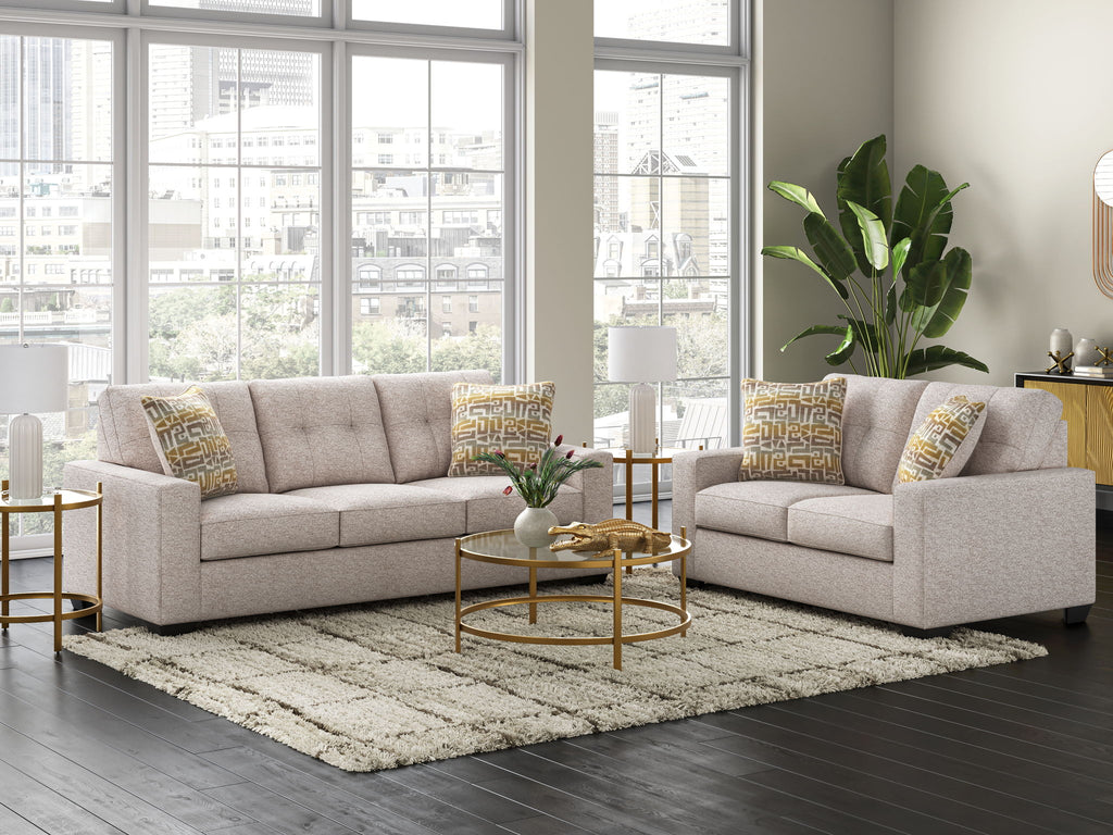 Beige fabric sofa and recliner set with patterned accent pillows