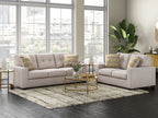 Beige fabric sofa and recliner set with patterned accent pillows