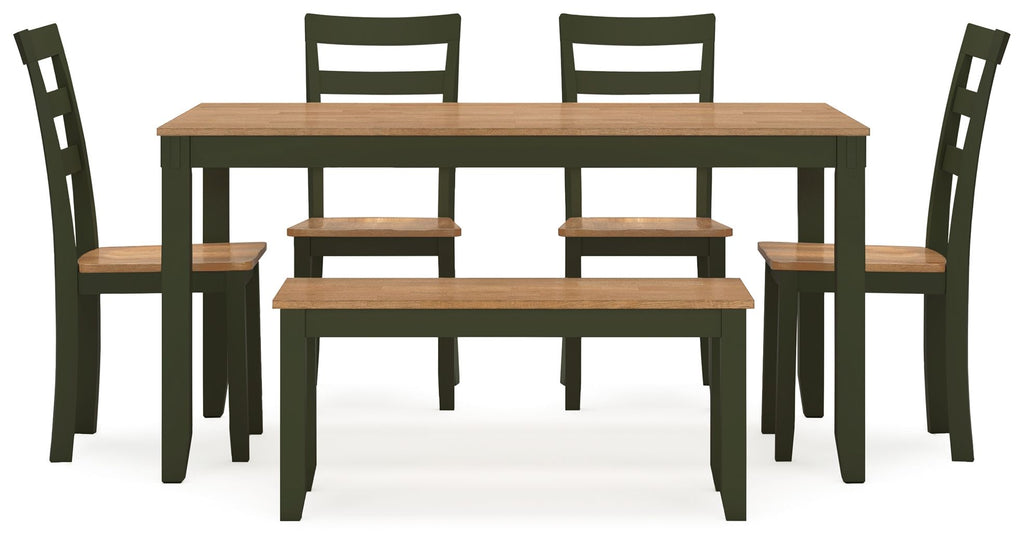 Dining room table set with bench, light wood tabletop and dark green chairs