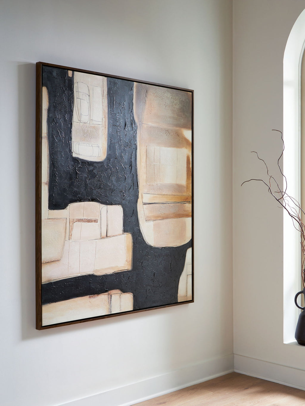 Framed abstract wall art with dark and cream rectangles and brown brushstroke blocks