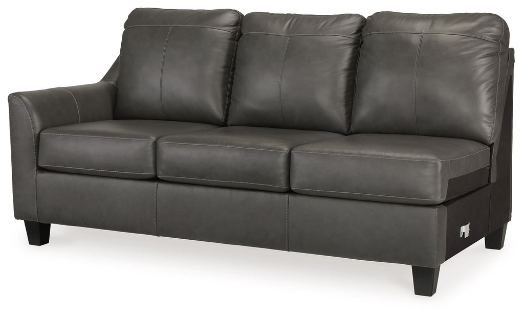 Dark gray leather sofa with three back cushions, three seat cushions, and tapered legs