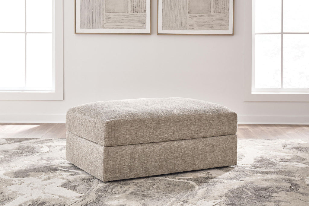 Oversized ottoman with rounded top, burlap-style beige fabric upholstery and short legs