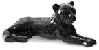 Black mosaic bear sculpture lying with head raised