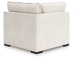 Vanilla-beige corner chair with track arms, squared seat, and dark block feet