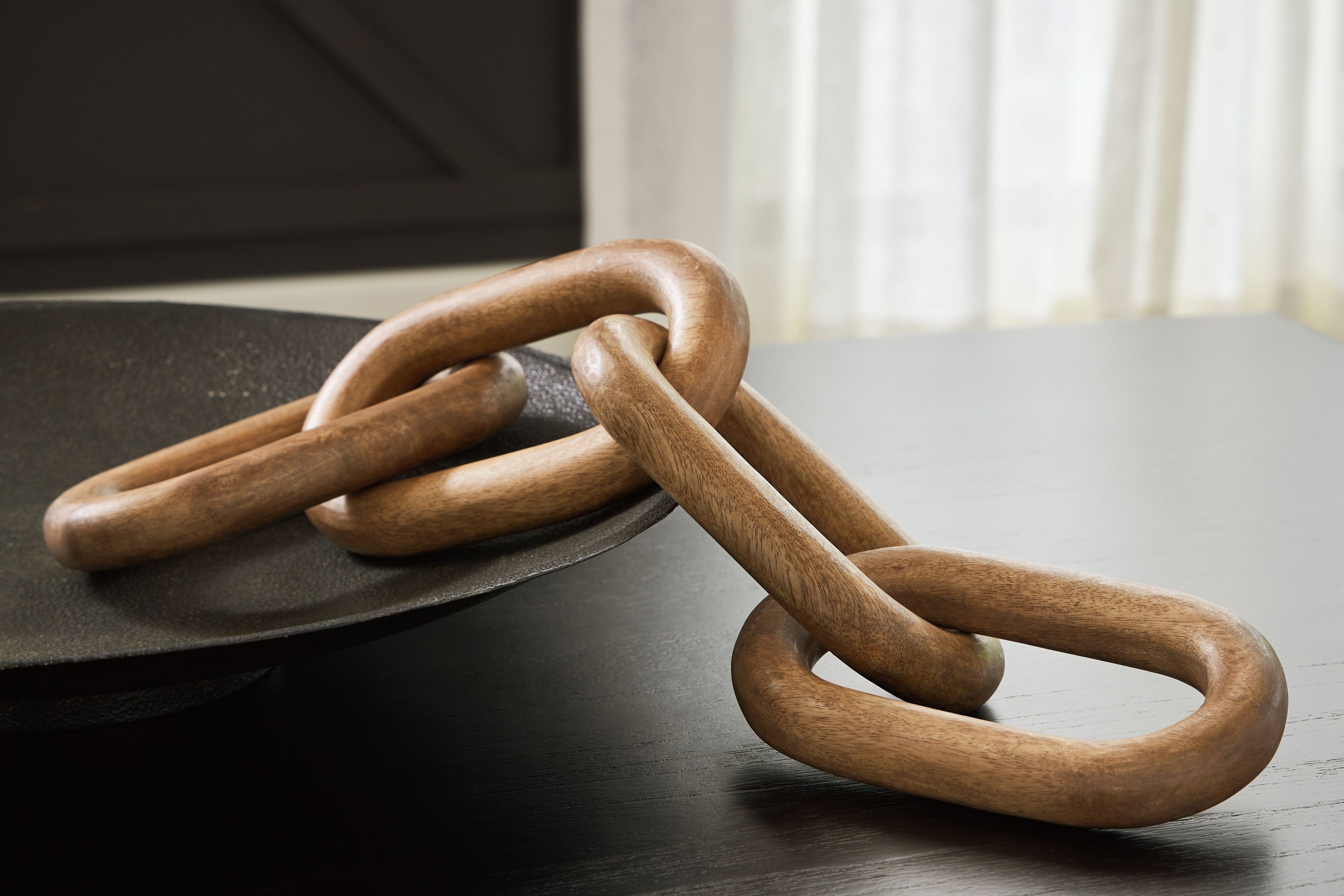 Light brown chain sculpture with long interlocking oval links