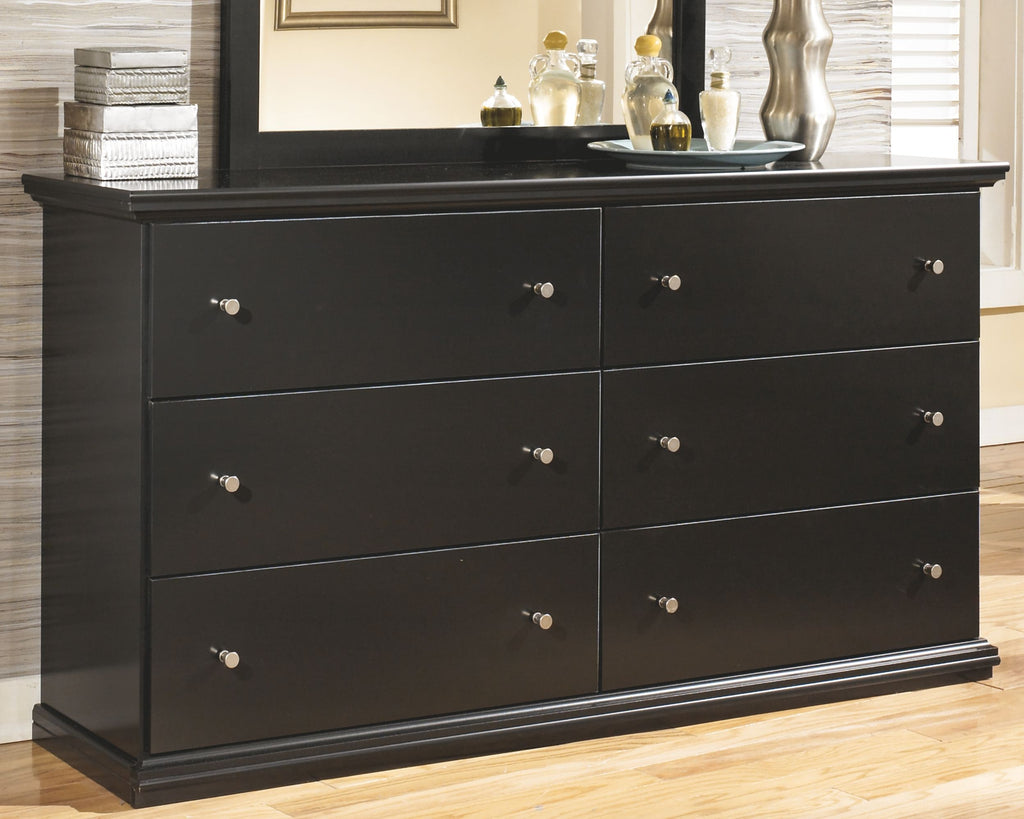 Black dresser with six drawers and round metal knobs, front view