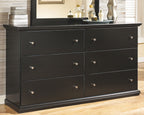 Black dresser with six drawers and round metal knobs, front view