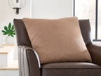 Brockbert brown square pillow on sofa, textured linen-look fabric