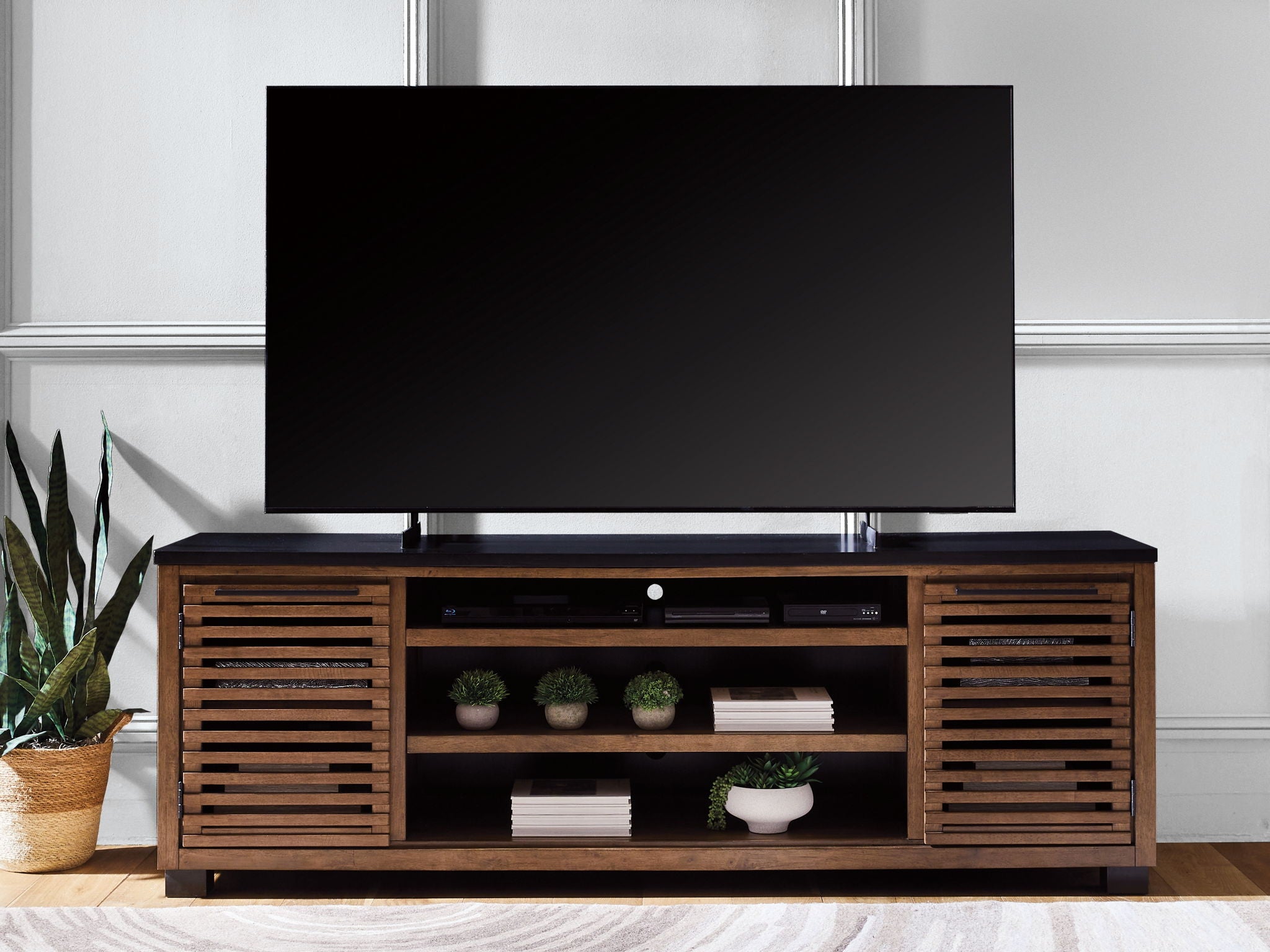 Dark brown TV stand with media shelves and slatted side doors